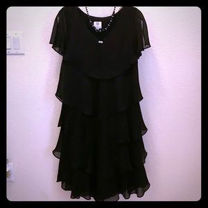 Black ruffle dress by Patra